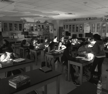 High school students in a lab, working on projects